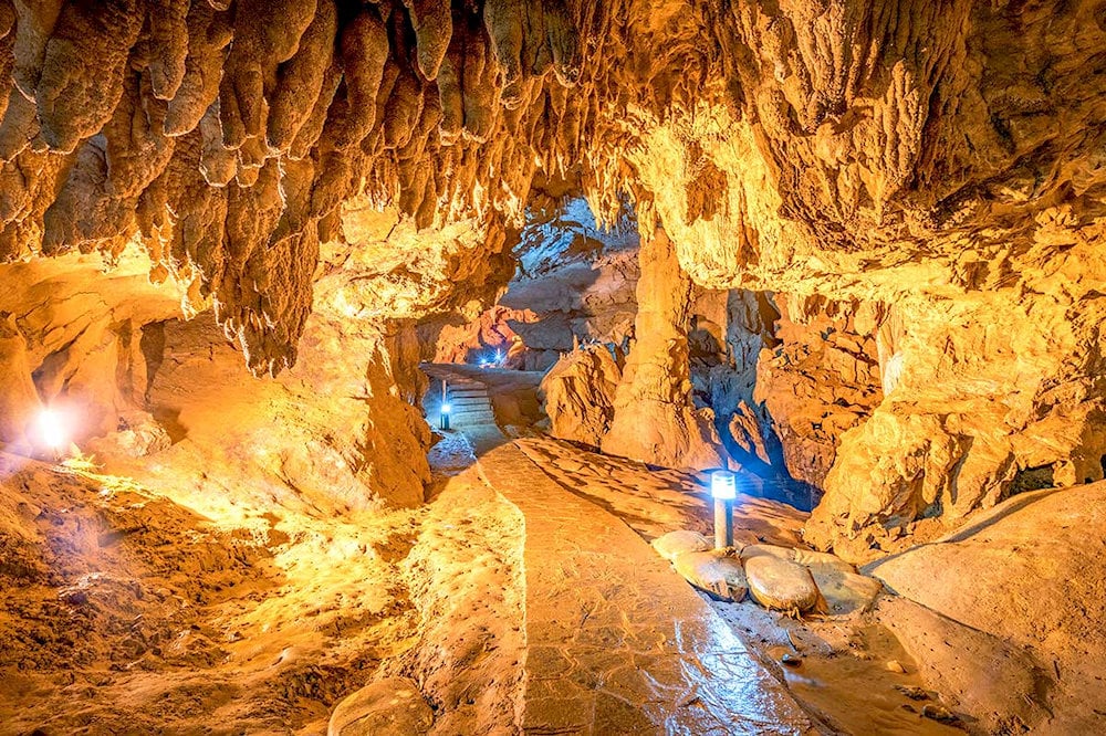 Dramatic limestone formations twist and curve like sculptural masterpieces shaped by millions of years